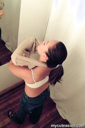 Sexy asian babe catch with a hidden cam in a changing room