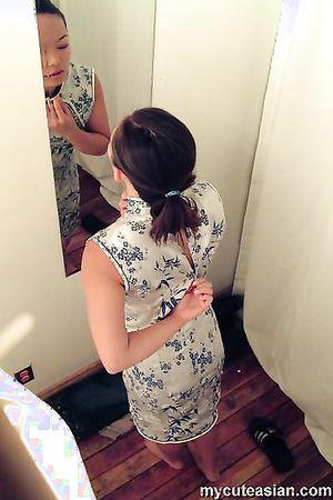Sexy asian babe catch with a hidden cam in a changing room
