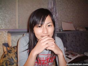 Shy Japanese amateur coed shows her tight hairy pussy here