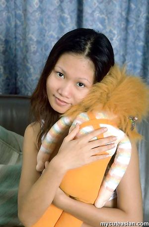 Petite asian babe opens her tight virgin pussy with a smile