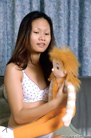 Petite asian babe opens her tight virgin pussy with a smile