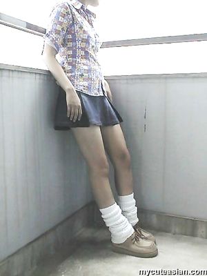 Shy japanese amateur coed shows her breasts and body outdoor