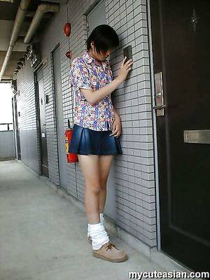 Shy japanese amateur coed shows her breasts and body outdoor