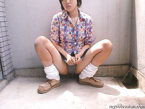 Shy japanese amateur coed shows her breasts and body outdoor