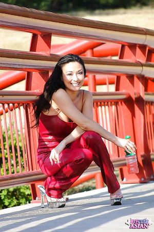 Asian model bares her tits to change into something more comfy