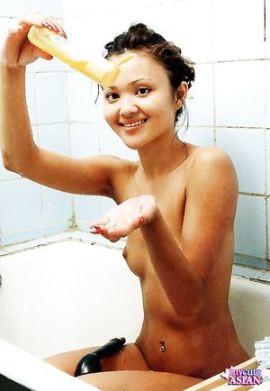 Little asian beauty soaps her perfect body in the shower