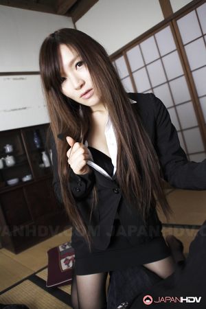 Hitomi Tsukishiro is so sensual while posing in office outfit outdoor.