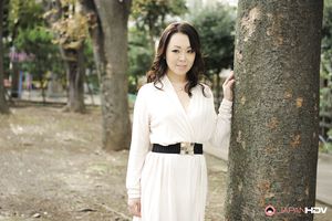 Asian Yuna Yamami in a white dress is very elegant and attractive.