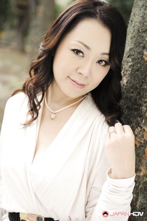 Asian Yuna Yamami in a white dress is very elegant and attractive.