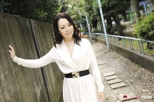 Asian Yuna Yamami in a white dress is very elegant and attractive.
