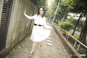 Asian Yuna Yamami in a white dress is very elegant and attractive.
