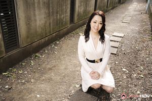 Asian Yuna Yamami in a white dress is very elegant and attractive.