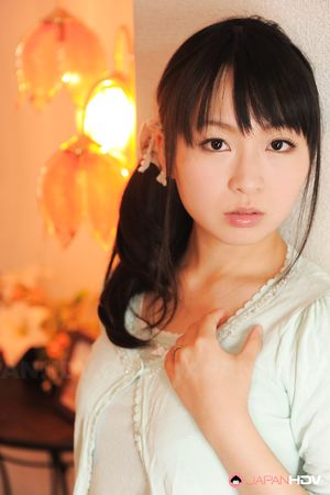 Sexy Nozomi Hazuki looks thoughtful and sweet while posing at home.