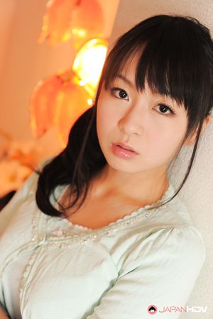 Sexy Nozomi Hazuki looks thoughtful and sweet while posing at home.