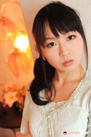 Sexy Nozomi Hazuki looks thoughtful and sweet while posing at home.