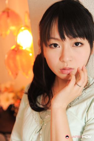 Sexy Nozomi Hazuki looks thoughtful and sweet while posing at home.