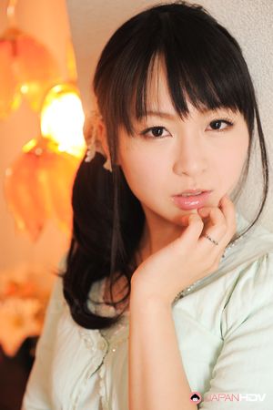 Sexy Nozomi Hazuki looks thoughtful and sweet while posing at home.