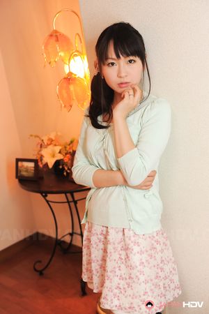 Sexy Nozomi Hazuki looks thoughtful and sweet while posing at home.