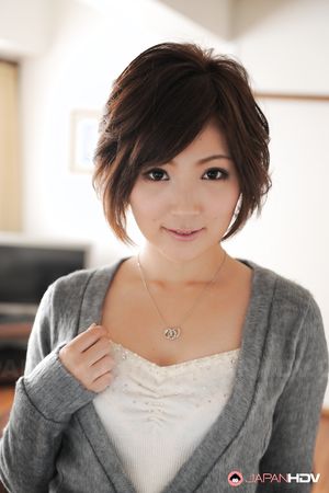 Asian Kaede Oshiro with busy mouth shows sexy legs in hot photos.