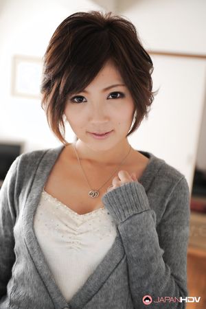 Asian Kaede Oshiro with busy mouth shows sexy legs in hot photos.