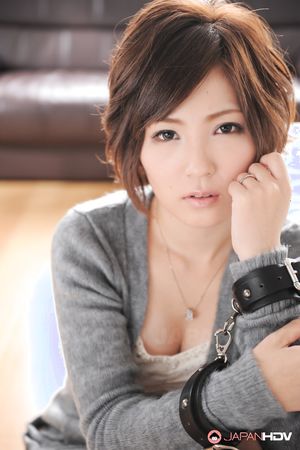 Asian Kaede Oshiro with busy mouth shows sexy legs in hot photos.