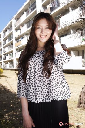 Hitomi Kano with long beautiful hair is happy to pose in neighborhood.