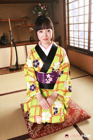 Beautiful raven haired Japanese darling bares her natural boobies