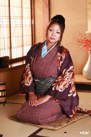 Beautiful Japanese gal shows her big naturals and that hairy twat