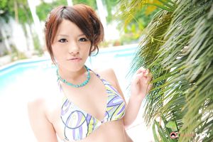 Brown haired Japanese summer girl posing by the pool in a bikini