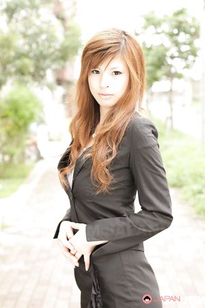 Stunning redhead office lady Rina Kikukawa posing outdoors with joy