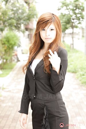 Stunning redhead office lady Rina Kikukawa posing outdoors with joy