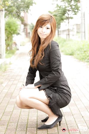 Stunning redhead office lady Rina Kikukawa posing outdoors with joy