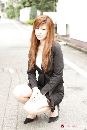 Stunning redhead office lady Rina Kikukawa posing outdoors with joy