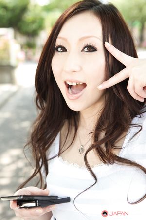 Long haired brunette Asuka Souma shows her beautiful body outdoors