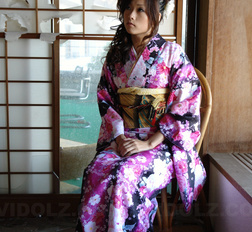 Asian Chiaki fucks her hairy pussy with toys under colorful kimono.