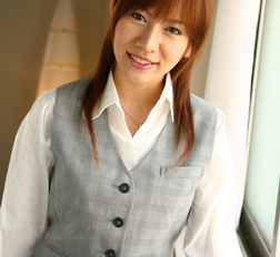 Asian Aki Yatou in uniform smiles a lot during this photo session.