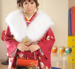 Asian Yuko Morita looks fantastic in a kimono and with a fur collar.