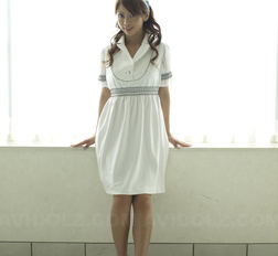 Misato Matsu looks so beautiful and stylish in a white dress for pics.