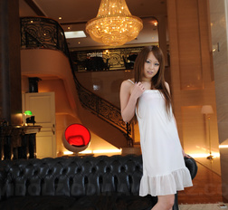 Hot Ichika shows her sexy legs under a long dress while posing.