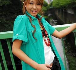 Asian Hitomi Mano poses outdoor and in her house in different outfits.