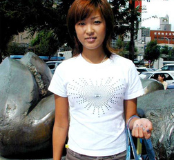 Horny asian amateur teen is stripping on the sofa and posing nude