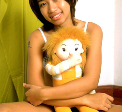 Young asian teen with small breasts spreads her tight hairy pussy