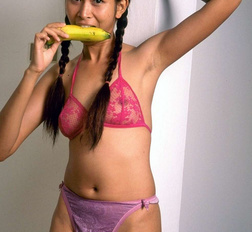 Naughty little asian slut eats banana and open her pussy wide