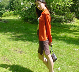 Long haired asian beauty shows her round tits in forest here