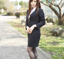 Naughty Hitomi Tsukishiro in office outfit poses so sexy outdoors.