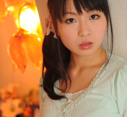 Sexy Nozomi Hazuki looks thoughtful and sweet while posing at home.