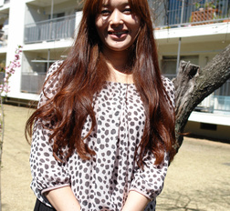 Hitomi Kano with long beautiful hair is happy to pose in neighborhood.